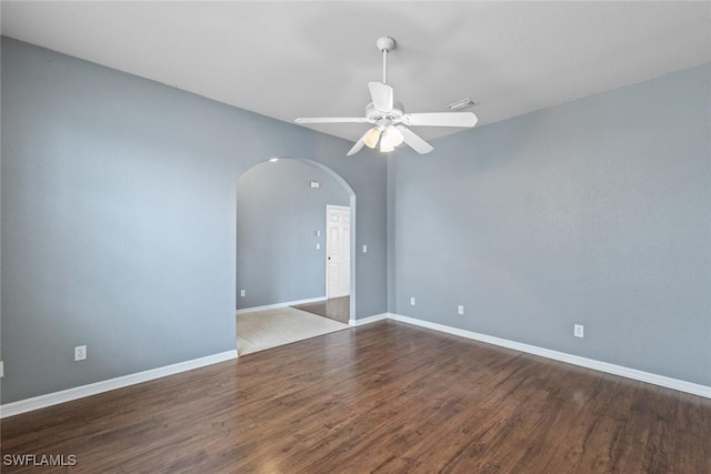 empty room with ceiling fan and light hardwood / wood-style floors