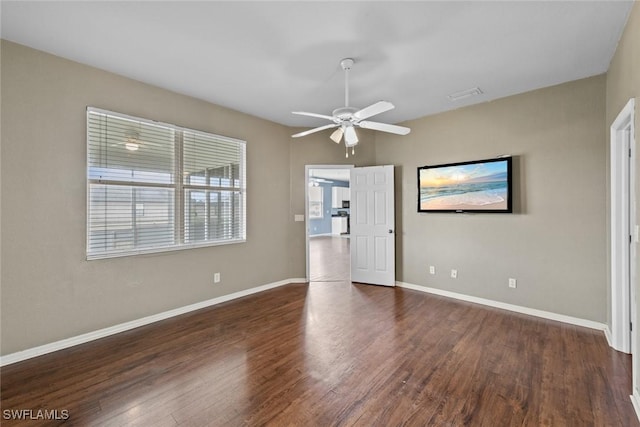 interior space with ceiling fan and dark hardwood / wood-style floors