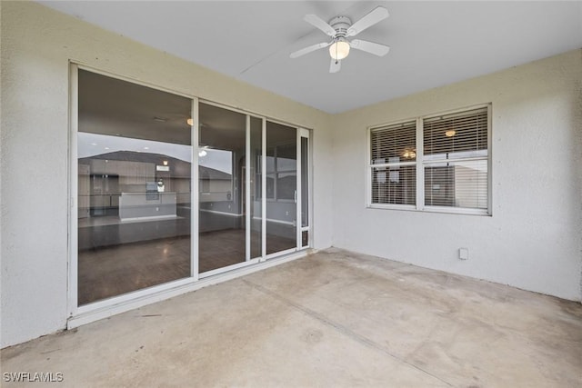 view of patio / terrace featuring ceiling fan