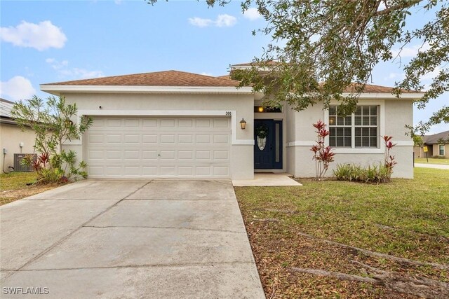 view of front of property featuring central air condition unit, a front lawn, and a garage