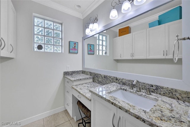 bathroom featuring baseboards, ornamental molding, vanity, and tile patterned floors