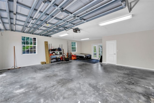 garage featuring french doors and a garage door opener