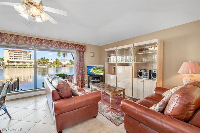 tiled living room with ceiling fan and a wealth of natural light