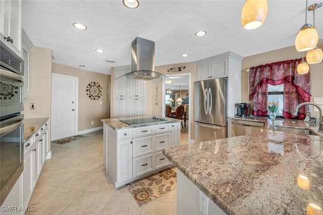 kitchen featuring island exhaust hood, appliances with stainless steel finishes, a kitchen island, sink, and white cabinetry