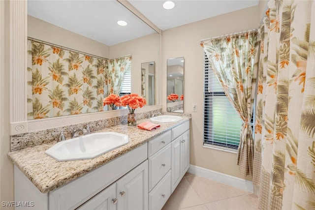 bathroom featuring tile patterned flooring and vanity