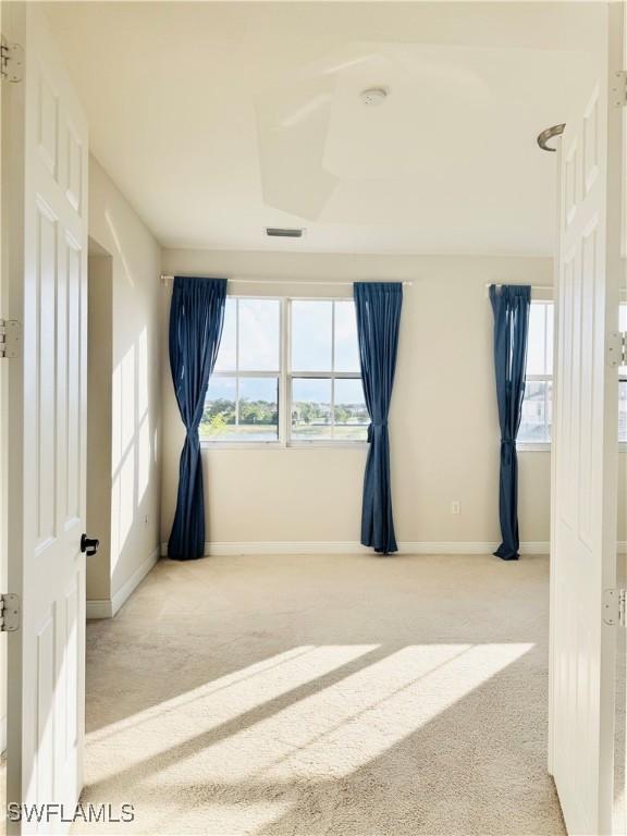 5161 Vizcaya St, Ave Maria, FL 34142 - empty room featuring carpet floors, baseboards, and a smoke detector