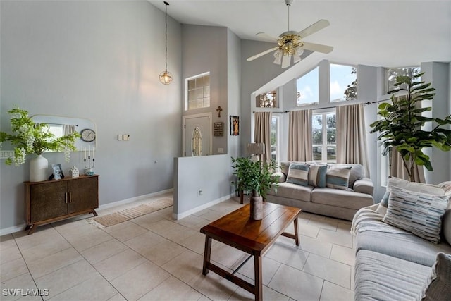 tiled living room featuring high vaulted ceiling and ceiling fan