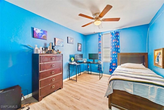 bedroom with ceiling fan and light wood-type flooring