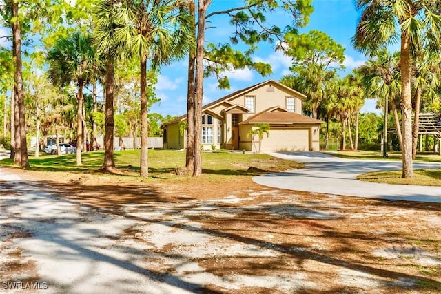 view of front facade with a front lawn and a garage