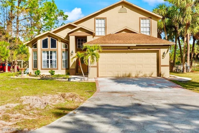 view of front of home featuring a front lawn and a garage