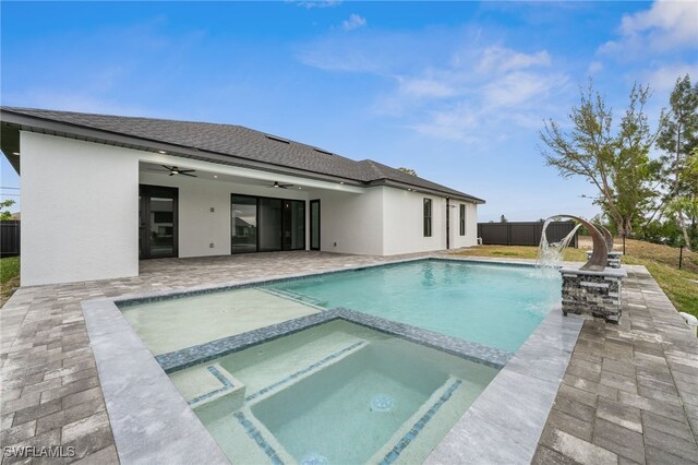 view of swimming pool featuring an in ground hot tub, a patio area, and ceiling fan