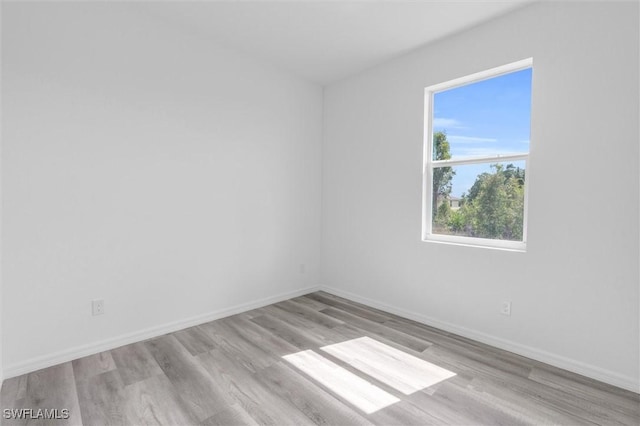 unfurnished room featuring light hardwood / wood-style flooring