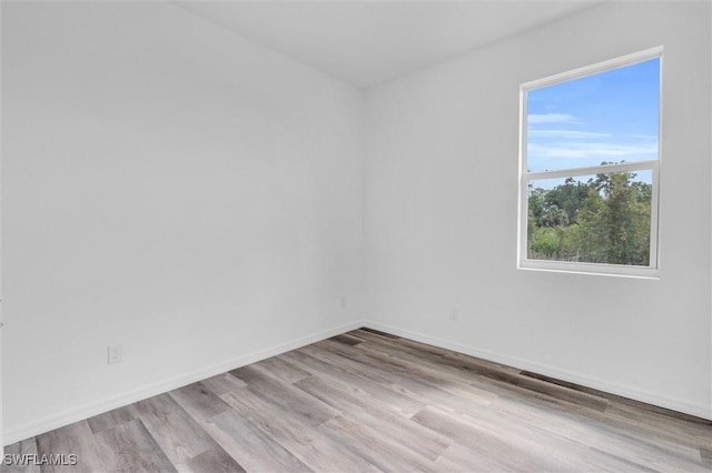 empty room with light wood-type flooring