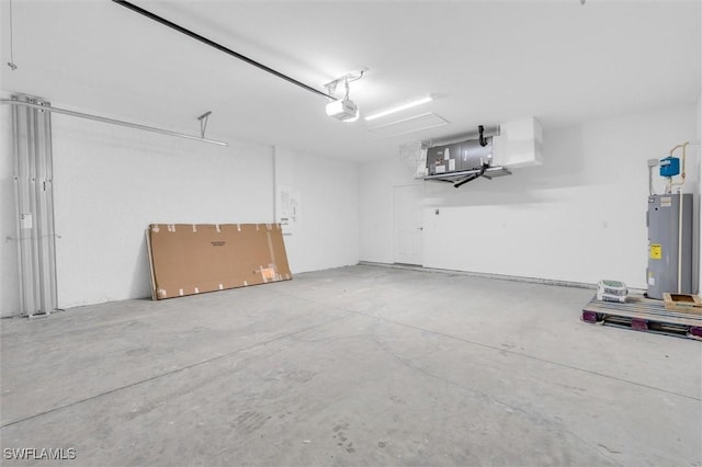 garage featuring electric water heater and a garage door opener