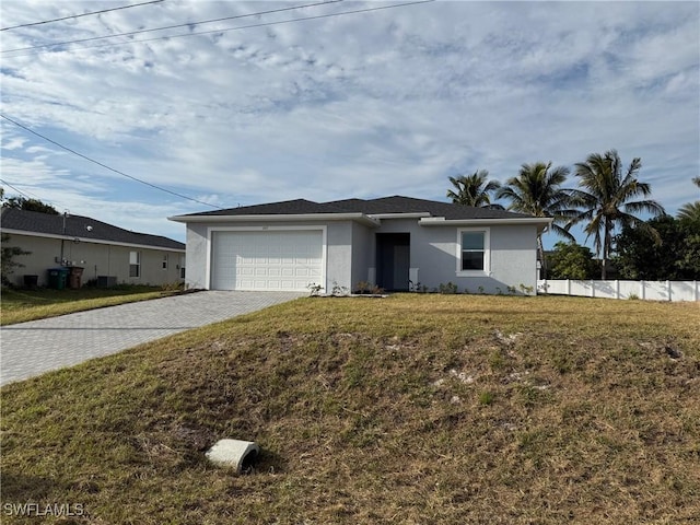 ranch-style house with a front yard and a garage