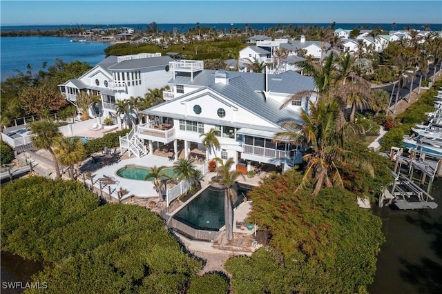 drone / aerial view with a water view