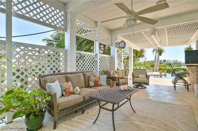 view of patio / terrace with an outdoor living space and ceiling fan