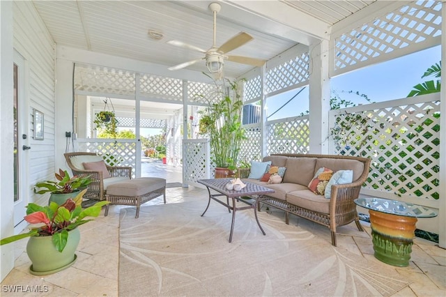 sunroom / solarium with ceiling fan and a healthy amount of sunlight