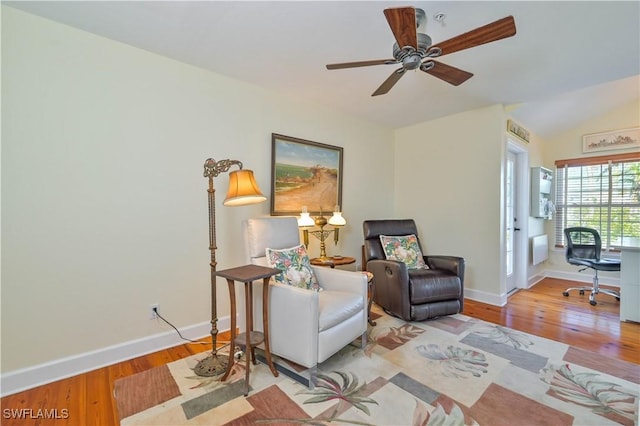 living area featuring ceiling fan and light hardwood / wood-style flooring