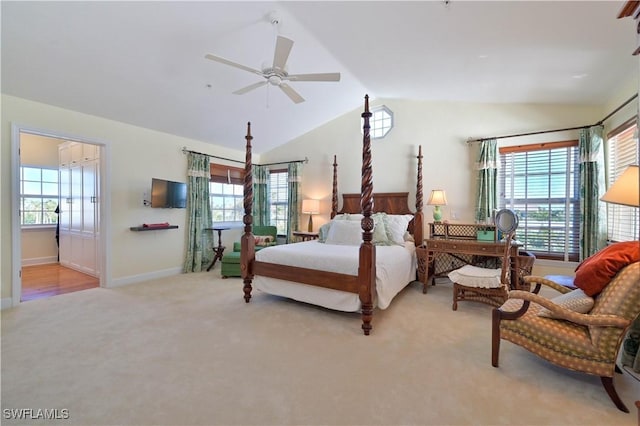 bedroom featuring multiple windows, light colored carpet, ceiling fan, and lofted ceiling