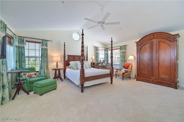 carpeted bedroom with ceiling fan and vaulted ceiling