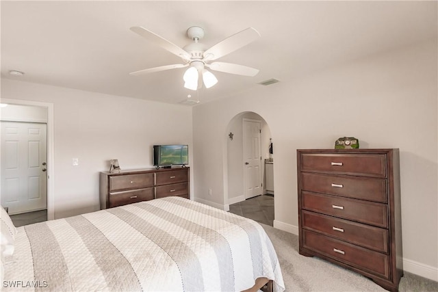 bedroom with light carpet and ceiling fan