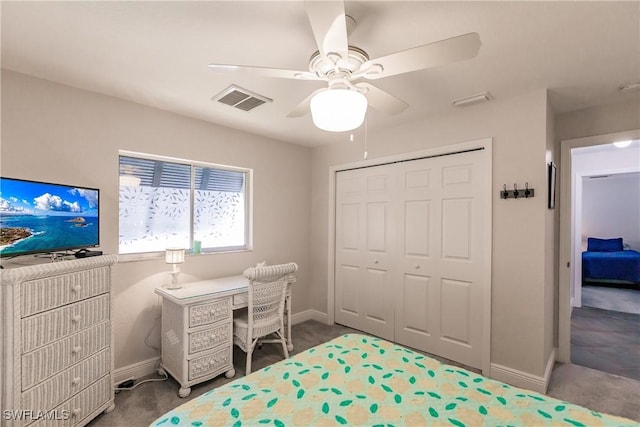 bedroom with ceiling fan, a closet, and carpet