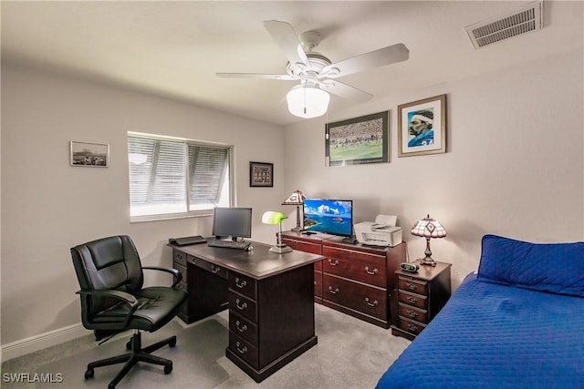 home office featuring light colored carpet and ceiling fan