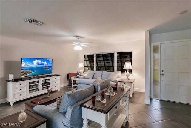 tiled living room with ceiling fan