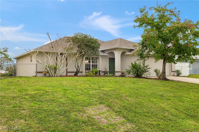 view of front of home featuring a garage and a front yard