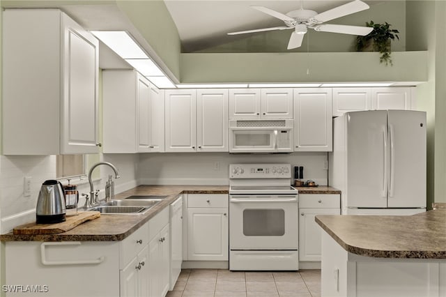 kitchen featuring white cabinetry, sink, light tile patterned flooring, and white appliances