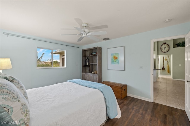 bedroom featuring dark wood-type flooring and ceiling fan