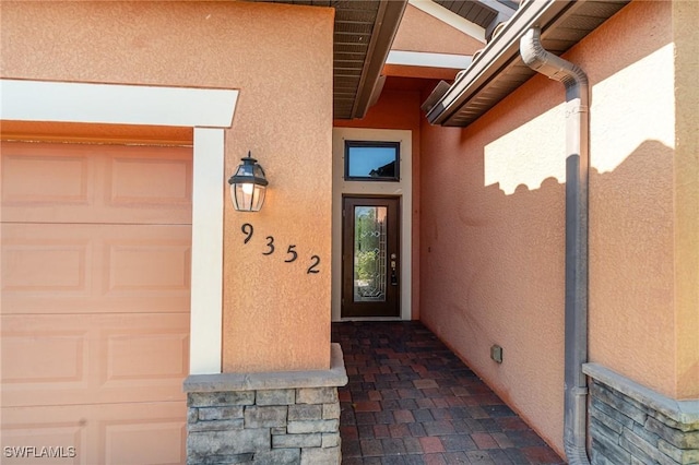 property entrance with a garage