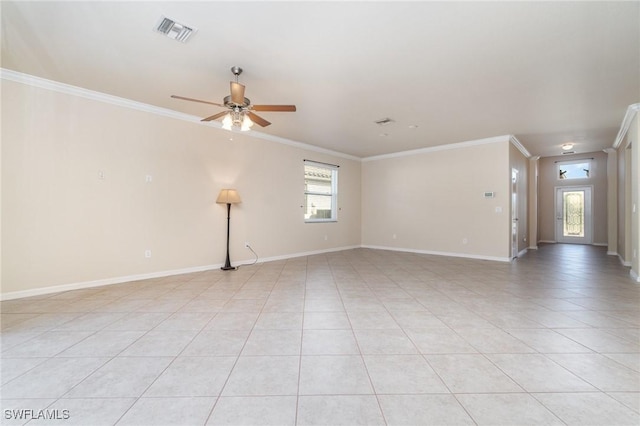 empty room featuring ceiling fan, light tile patterned flooring, and crown molding