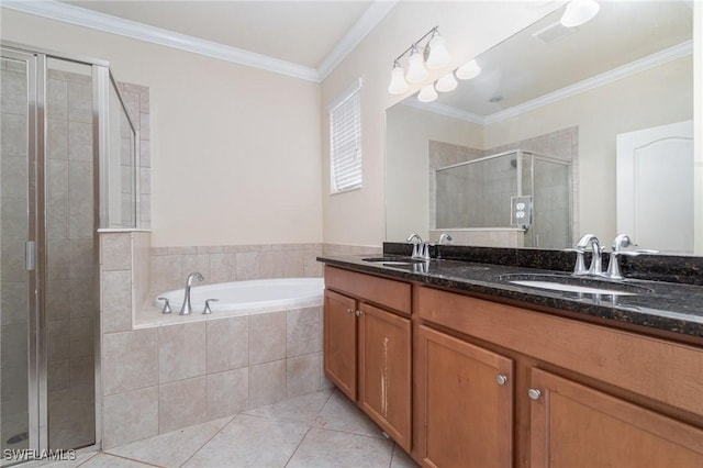 bathroom with tile patterned floors, crown molding, vanity, and shower with separate bathtub