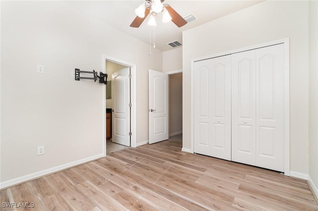 unfurnished bedroom featuring light wood-type flooring, a closet, and ceiling fan