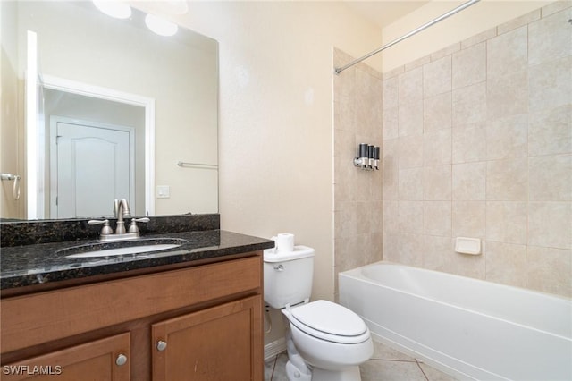 full bathroom with tile patterned floors, vanity, toilet, and tiled shower / bath