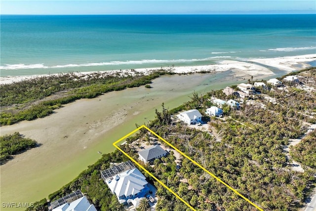 aerial view featuring a water view and a view of the beach