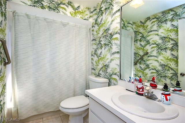 bathroom featuring vanity, tile patterned floors, and toilet