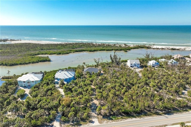 bird's eye view with a beach view and a water view