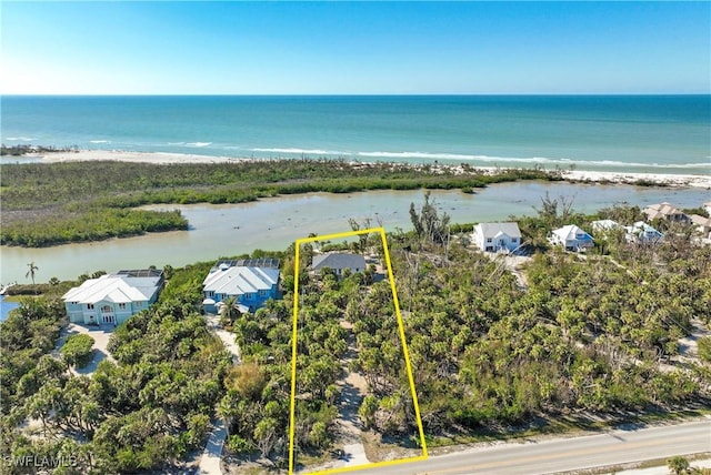 bird's eye view featuring a beach view and a water view