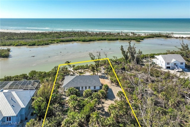 aerial view featuring a view of the beach and a water view