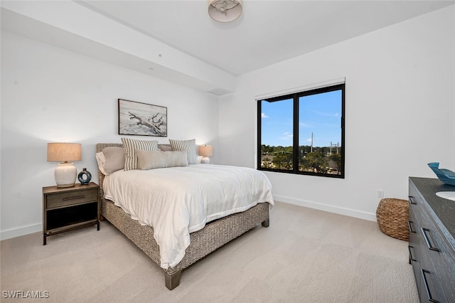 bedroom featuring light colored carpet