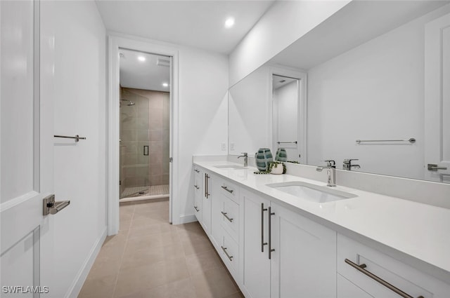 bathroom with vanity, tile patterned floors, and walk in shower