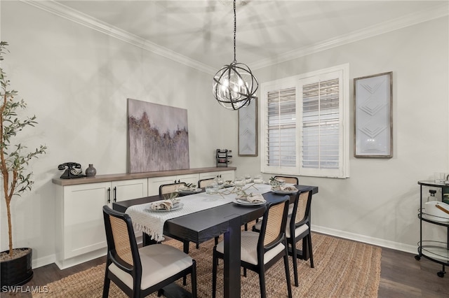 dining area featuring dark wood-type flooring, ornamental molding, and a chandelier