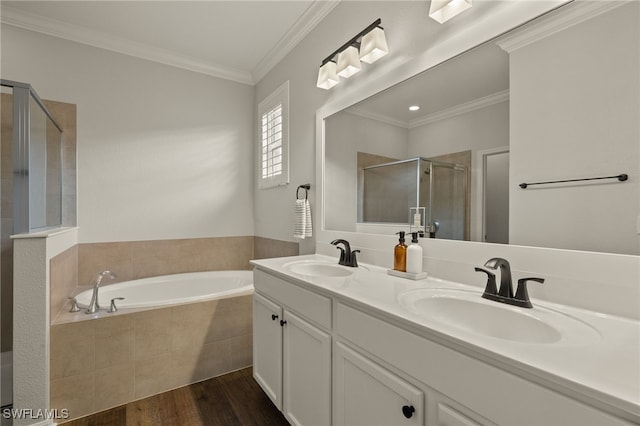 bathroom with ornamental molding, separate shower and tub, vanity, and wood-type flooring