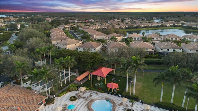 aerial view at dusk with a water view