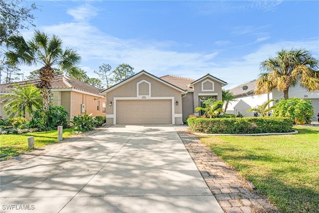 view of front of house featuring a front yard and a garage