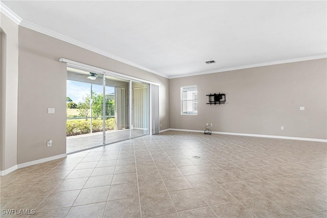 tiled empty room featuring crown molding