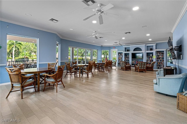 dining area with crown molding, ceiling fan, and plenty of natural light